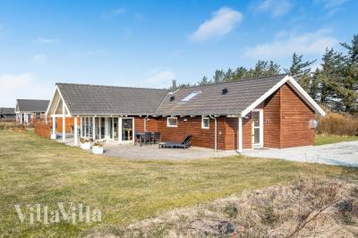 Dette skønne poolhus nr. 236 med plads til 14 personer ligger i Nordjylland