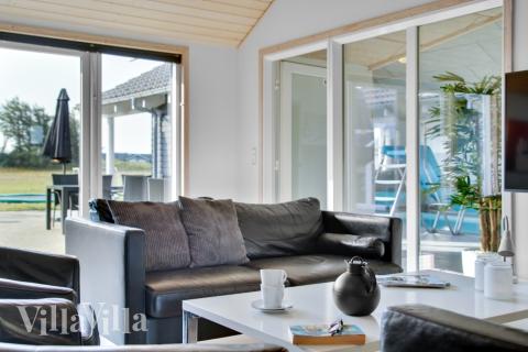 Sofaen i luksushus 194 i Nordjylland indbyder til brætspil eller at se en film sammen.