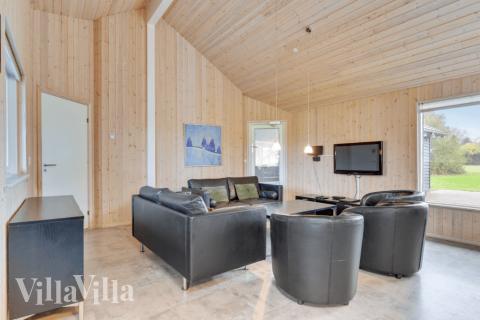 Sofaen i luksushus 231 i Sydjylland indbyder til brætspil eller at se en film sammen.