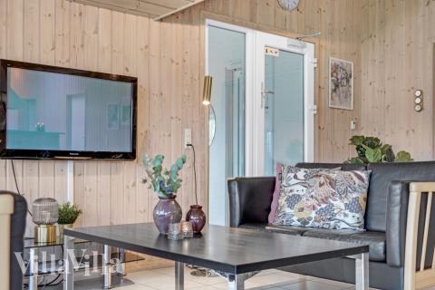 Sofaen i luksushus 262 i Sydjylland indbyder til brætspil eller at se en film sammen.