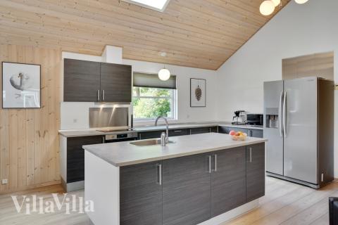 Sofaen i luksushus 277 i Nordsjælland indbyder til brætspil eller at se en film sammen.