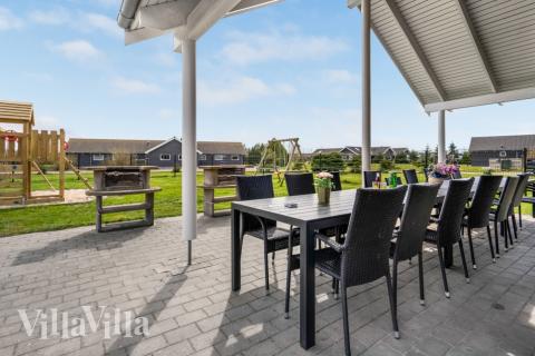 Nyd en grillaften på terrassen i luksushus nr. 202 i Lolland/Falster/Møn