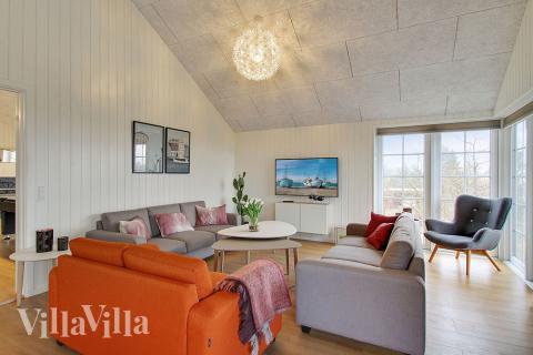 Opholdsrum med plads til 18 i luksushus nr. 386.