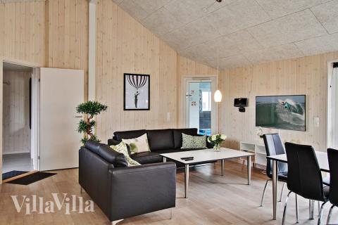 Opholdsrum med plads til 24 i luksushus nr. 701.