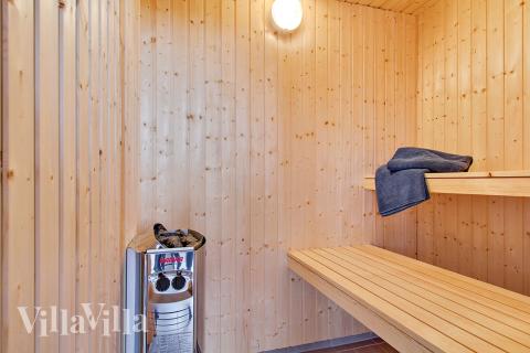 Nyd varmen i saunaen i luksushus nr. 712 til 18 personer