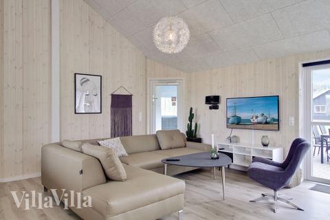 Opholdsrum med plads til 24 i luksushus nr. 706.