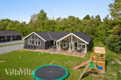 Dette skønne poolhus nr. 416 med plads til 16 personer ligger i Nordsjælland