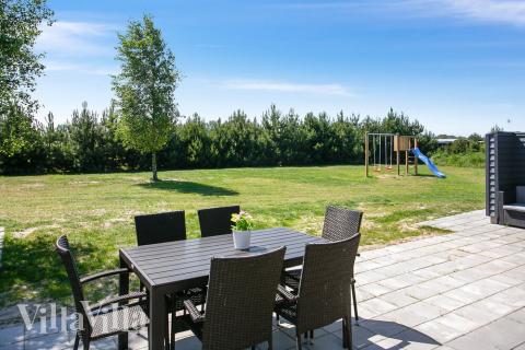 Nyd en grillaften på terrassen i luksushus nr. 413 i Lolland/Falster/Møn