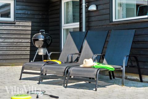 Nyd en grillaften på terrassen i luksushus nr. 427 i Lolland/Falster/Møn