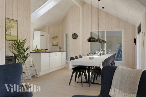 I kan sagtens side 16 personer sammen i sommerhusets opholdsrum, når I besøger luksushus 433 i Lolland/Falster/Møn.