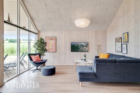 Sofaen i luksushus 501 i Nordsjælland indbyder til brætspil eller at se en film sammen.