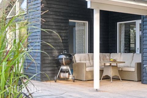 Nyd en grillaften på terrassen i luksushus nr. 511 i Lolland/Falster/Møn