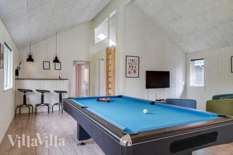 Ud over de mange timer, man kan bruge i husets pool-afdeling, så byder luksushus 506 også på billard/bordtennis og dart