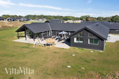 Dette skønne poolhus nr. 497 med plads til 26 personer ligger i Sydjylland