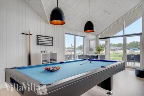 Ud over de mange timer, man kan bruge i husets pool-afdeling, så byder luksushus 516 også på billard/bordtennis og dart