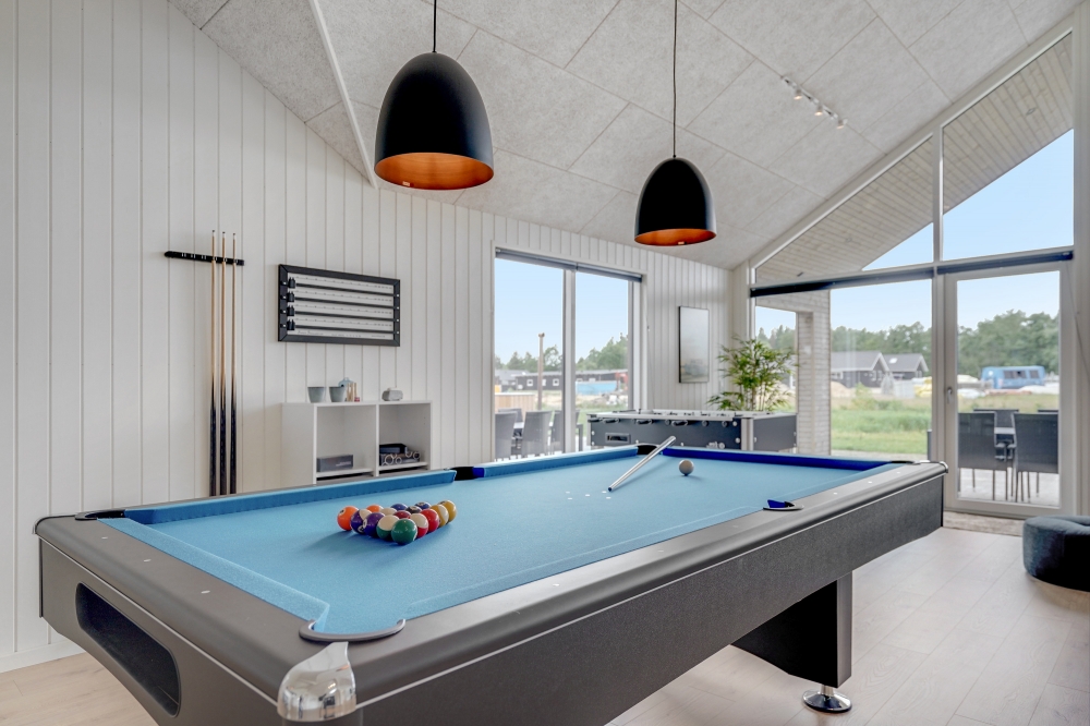 Ud over de mange timer, man kan bruge i husets pool-afdeling, så byder luksushus 516 også på billard/bordtennis og dart