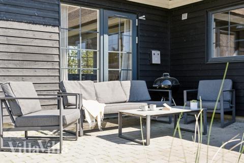 Nyd en grillaften på terrassen i luksushus nr. 518 i Vestjylland