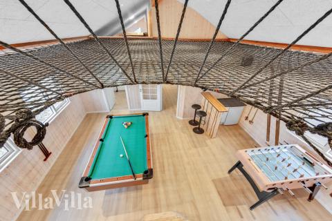 Dyst i sommerhusets aktivitetsrum, når I besøger luksushus nr. 539 i Limfjorden.