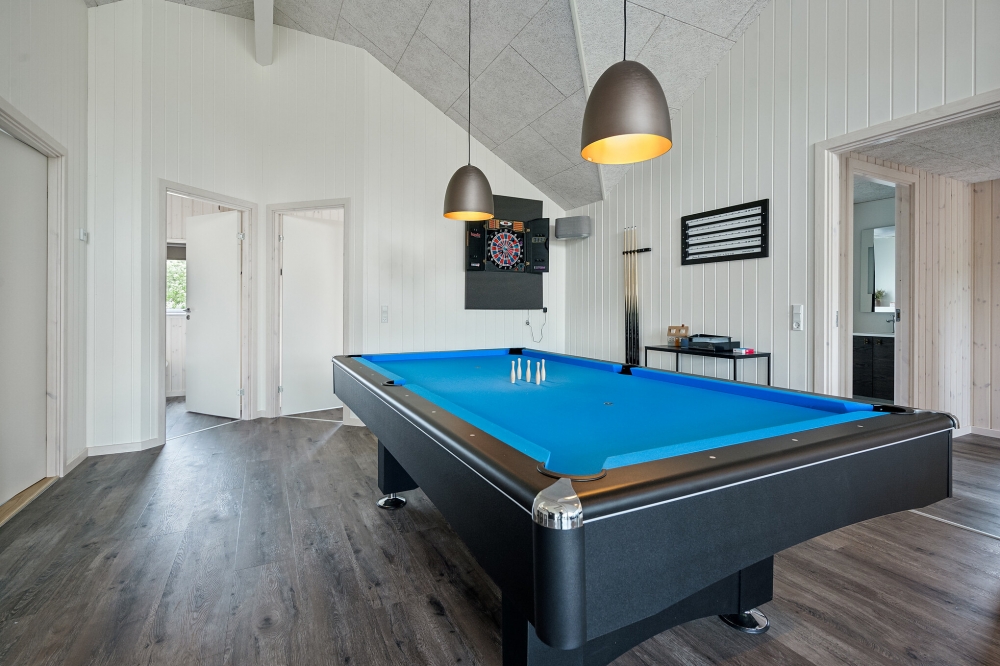 Ud over de mange timer, man kan bruge i husets pool-afdeling, så byder luksushus 611 også på billard/bordtennis og dart