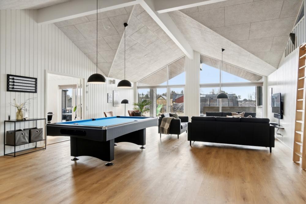 Ud over de mange timer, man kan bruge i husets pool-afdeling, så byder luksushus 619 også på billard/bordtennis og dart