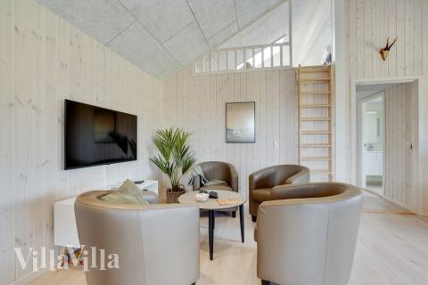 Dyst i sommerhusets aktivitetsrum, når I besøger luksushus nr. 802 i Østjylland.