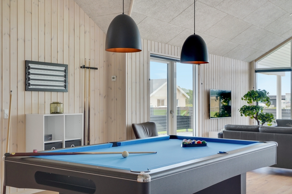 Ud over de mange timer, man kan bruge i husets pool-afdeling, så byder luksushus 830 også på billard/bordtennis og dart