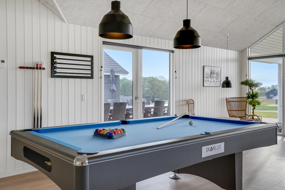 Ud over de mange timer, man kan bruge i husets pool-afdeling, så byder luksushus 815 også på billard/bordtennis og dart