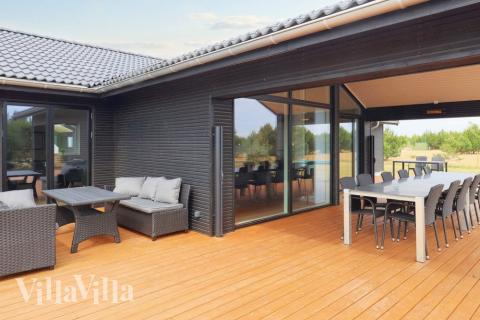 Nyd en grillaften på terrassen i luksushus nr. 649 i Lolland/Falster/Møn