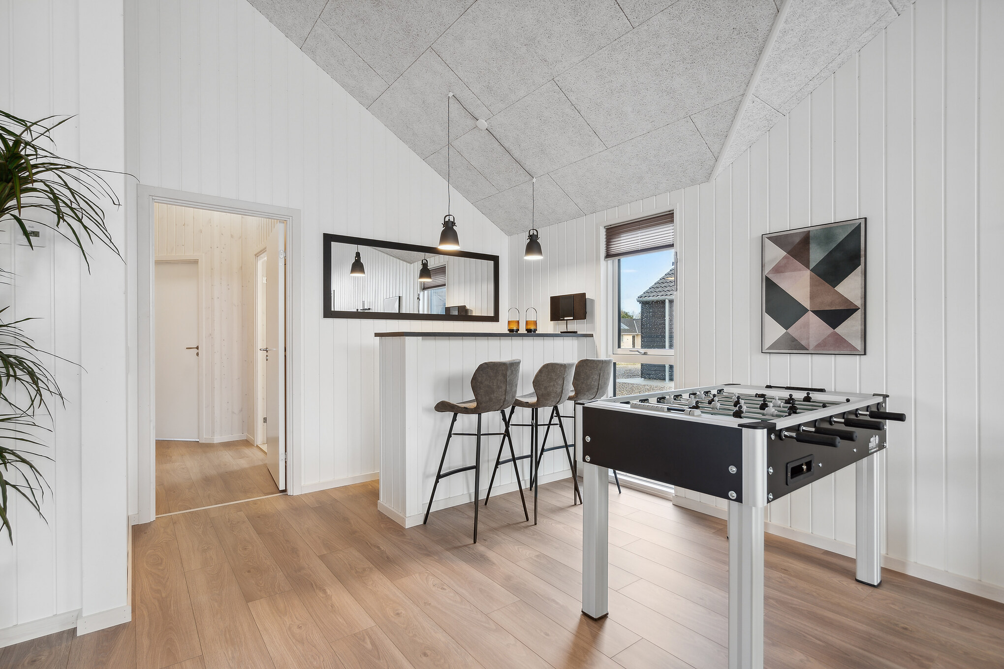 Dyst i sommerhusets aktivitetsrum, når I besøger luksushus nr. 699 i Nordjylland.
