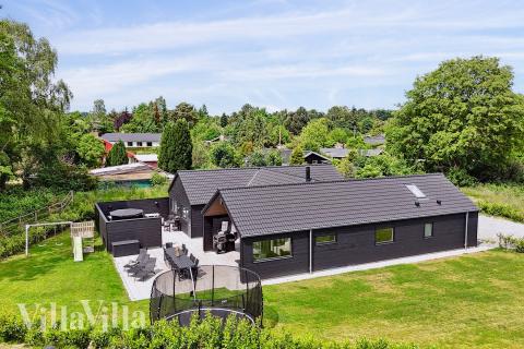 Dette skønne poolhus nr. 584 med plads til 14 personer ligger i Nordsjælland