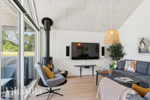 Sofaen i luksushus 685 i Nordsjælland indbyder til brætspil eller at se en film sammen.