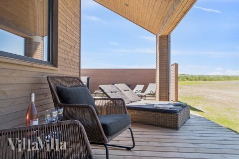 Nyd en grillaften på terrassen i luksushus nr. 671 i Fyn og øer