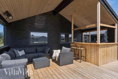 Nyd en grillaften på terrassen i luksushus nr. 656 i Nordjylland