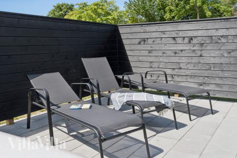 Nyd en grillaften på terrassen i luksushus nr. 644 i Lolland/Falster/Møn