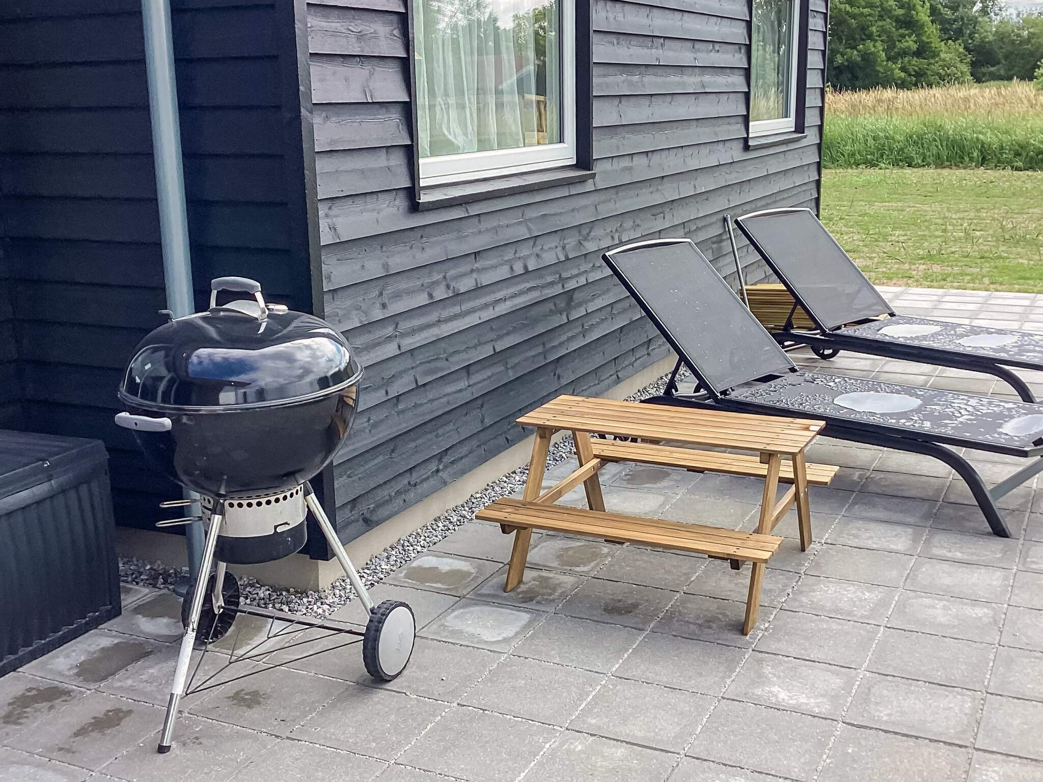 Nyd en grillaften på terrassen i luksushus nr. 670 i Lolland/Falster/Møn