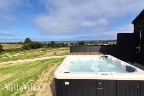 Nyd varmen i spaen i luksushus nr. 668 i Fyn og øer