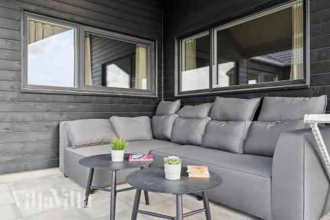 Nyd en grillaften på terrassen i luksushus nr. 655 i Fyn og øer