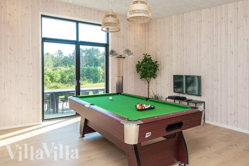 Ud over de mange timer, man kan bruge i husets pool-afdeling, så byder luksushus 938 også på billard/bordtennis og dart