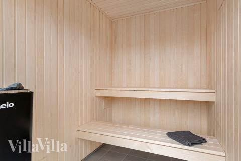 Nyd varmen i saunaen i luksushus nr. 900 til 18 personer