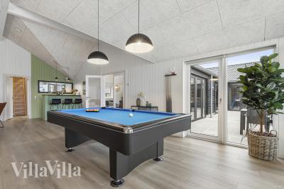 Ud over de mange timer, man kan bruge i husets pool-afdeling, så byder luksushus 814 også på billard/bordtennis og dart
