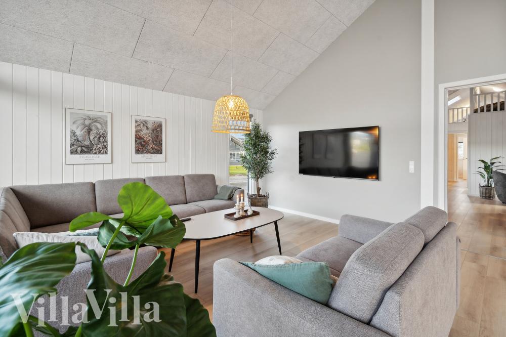 Der er mulighed for hygge i sommerhusets sofaarrangement, når I besøger luksushus nr. 772