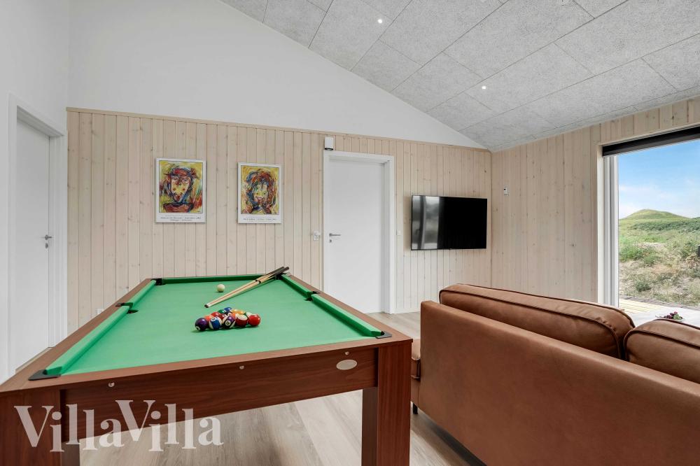 Ud over de mange timer, man kan bruge i husets pool-afdeling, så byder luksushus 945 også på billard/bordtennis og dart