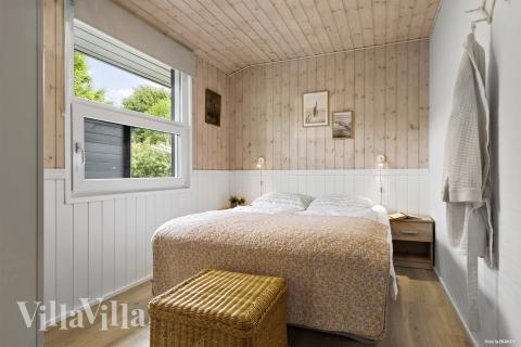 Der er mulighed for hygge i sommerhusets sofaarrangement, når I besøger luksushus nr. 964