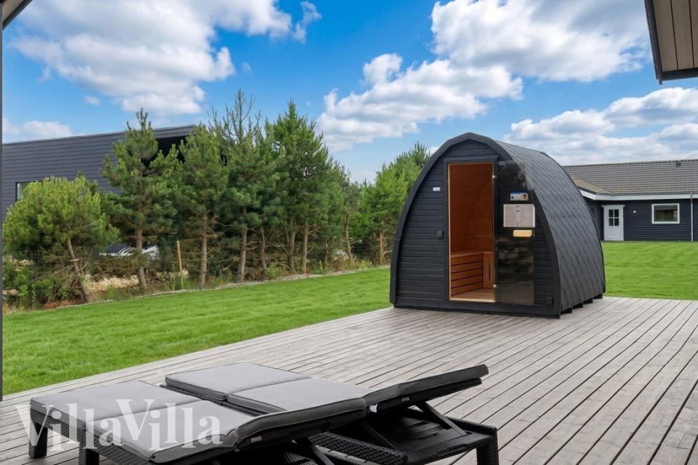 Luksushus nr. 976 har en dejlig terrasse med gode havemøbler til 14 personer.