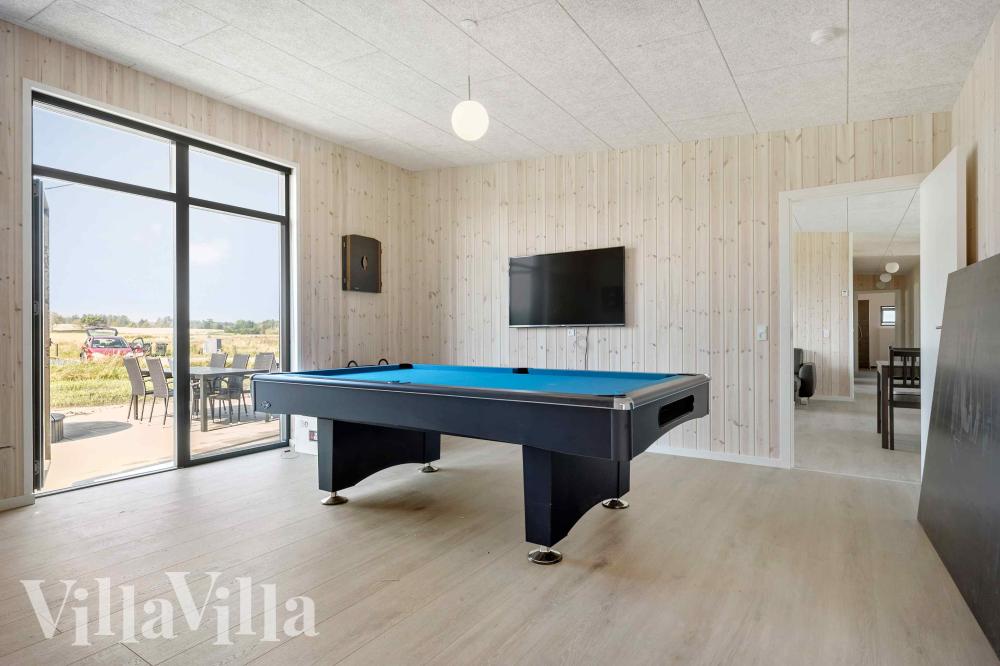 Ud over de mange timer, man kan bruge i husets pool-afdeling, så byder luksushus 1014 også på billard/bordtennis og dart
